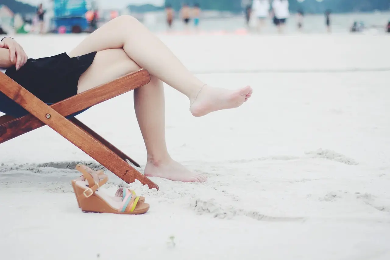 woman, beach, beach chair, feet, female, barefoot, girl, lady, legs, nature, leisure, outdoors, recreation, relaxation, resort, resting, sand, sandals, sitting, wooden chair, sandy beach, shore, seashore